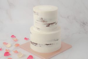 two tier half masked cake