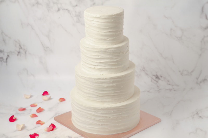 four tier ruffled wedding cake