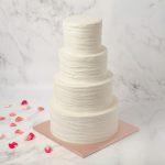 Wedding four tiers ruffled cake arapina london