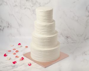 four tier ruffled wedding cake