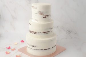 three tier half masked wedding cake