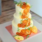 Wedding three tiers ruffled orange rosemary cake
