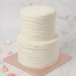 two tiers ruffled wedding cake
