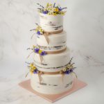 four tiershalf masked wedding cake