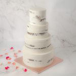 Wedding four tiers half masked cake