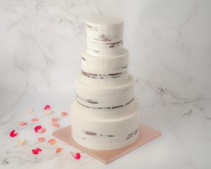 four tier half masked wedding cake