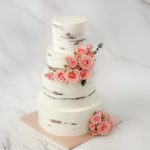 four tiers half masked roses wedding cake